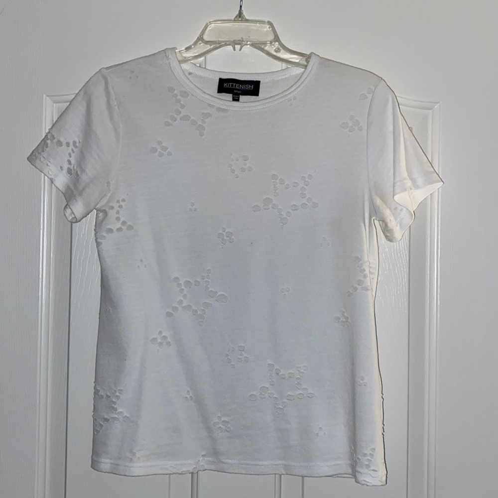 Cute white tee with star details.